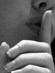 Finger to lips Charlotte Divorce Lawyer Mecklenburg Alienation of affection Attorney
