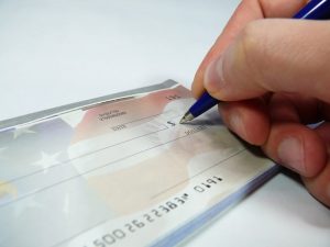 Writing a check Charlotte Divorce Lawyer