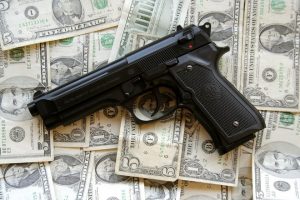 Handgun on pile of cash Charlotte Divorce Lawyer