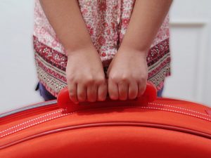 child-with-suitcase-Charlotte-Union-County-Iredell-County-Child-Custody-Order-Lawyer-300x225