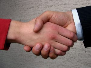 shaking-hands-mediator-arbitration-Charlotte-Mooresville-Monroe-Family-lawyer-300x225