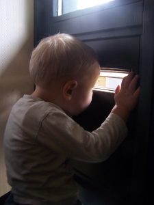 boy-at-mail-slot-Charlotte-Monroe-Mooresville-Divorce-Lawyer-225x300