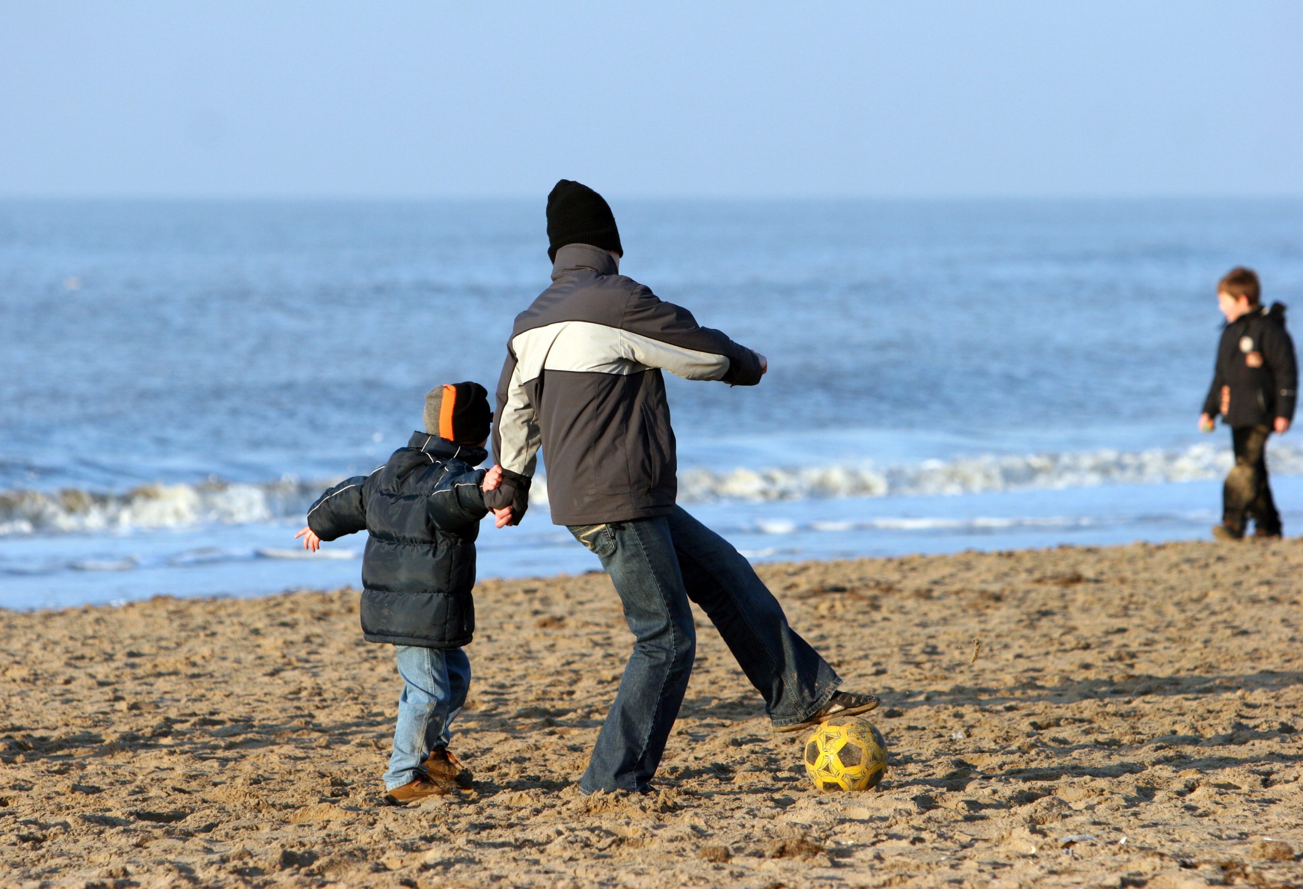 playing-on-the-beach-Charlotte-Monroe-Mooresville-Child-Custody-Lawyers-scaled