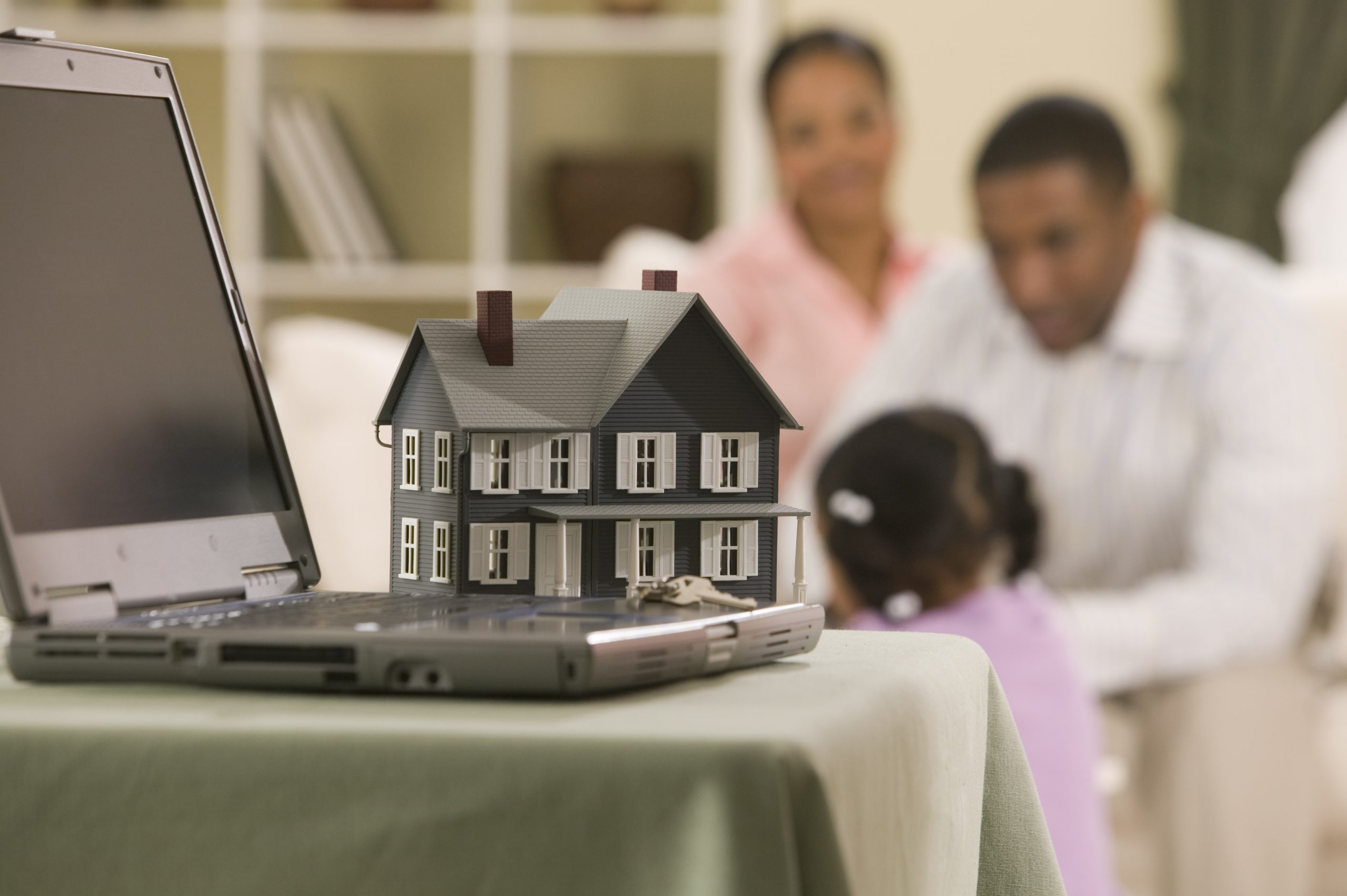 model-house-and-laptop-computer-1983018-scaled